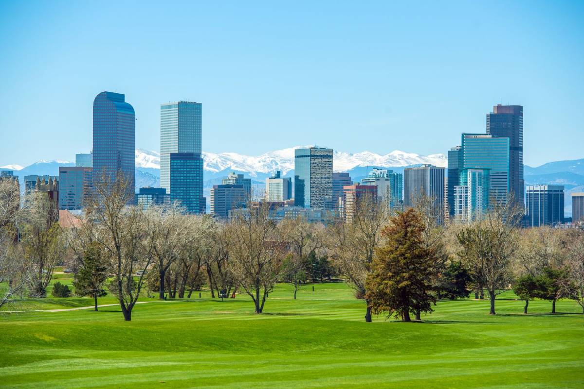 Denver city skyline with the Rocky Mountains in the background